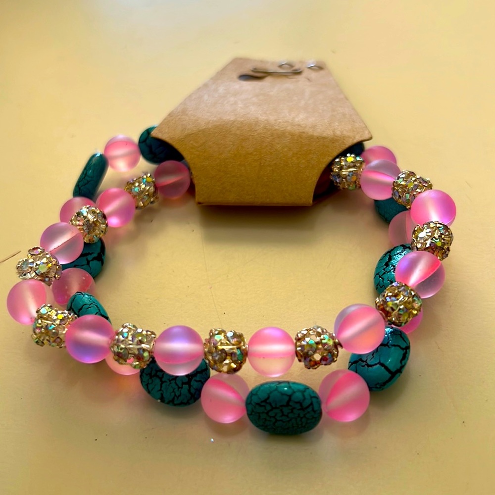 2illuminating bracelets changes color as light hits it 6 1/2 inches stretchy